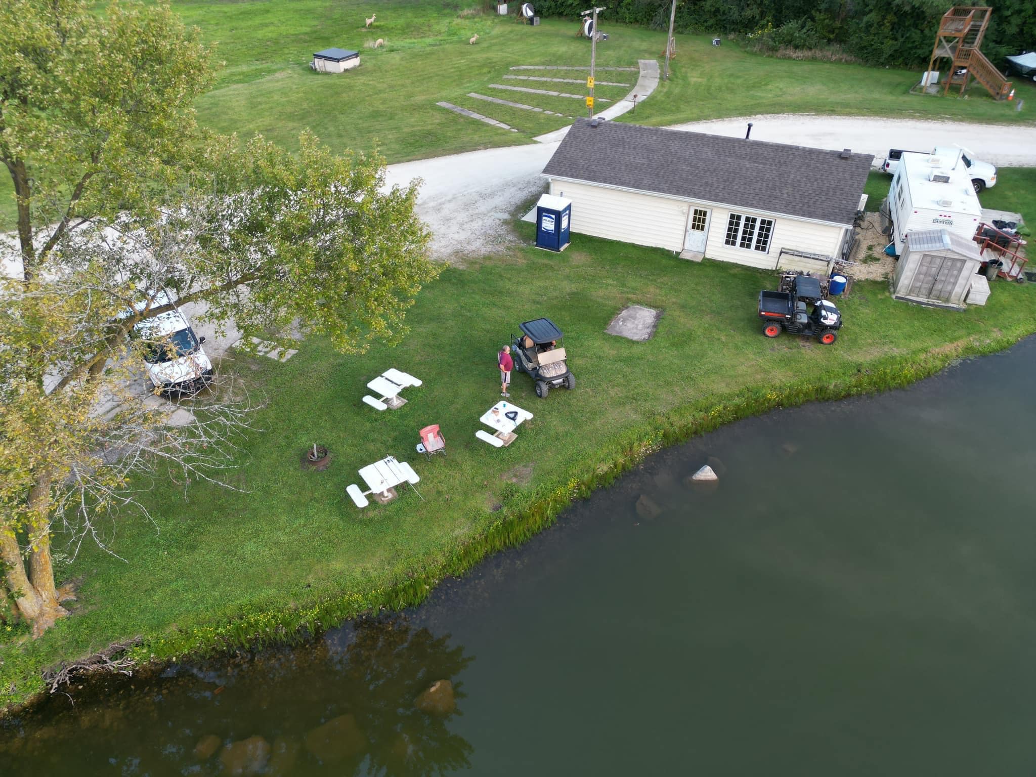 Aerial view of Deer Creek Recreation Club clubhouse, beach, and lake in Plainfield Illinois